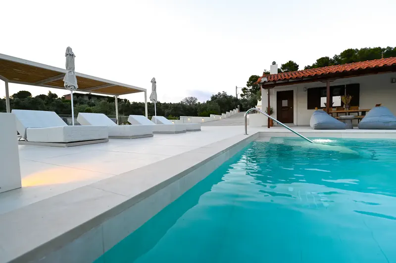 The length of the pool with the house along one side